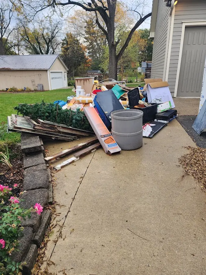 Dumpster being loaded with debris for Commercial Dumpster Rental in Marco Island
